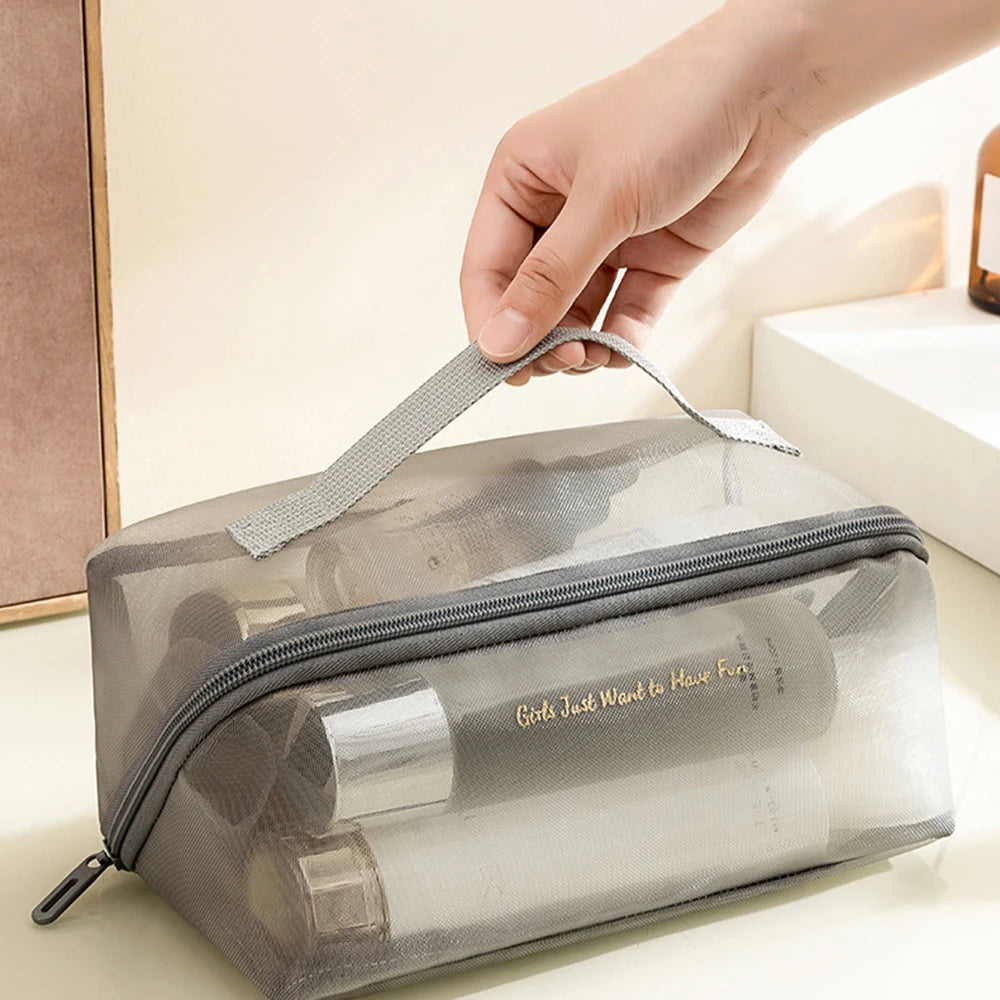 Trousse maquillage transparente rose fun